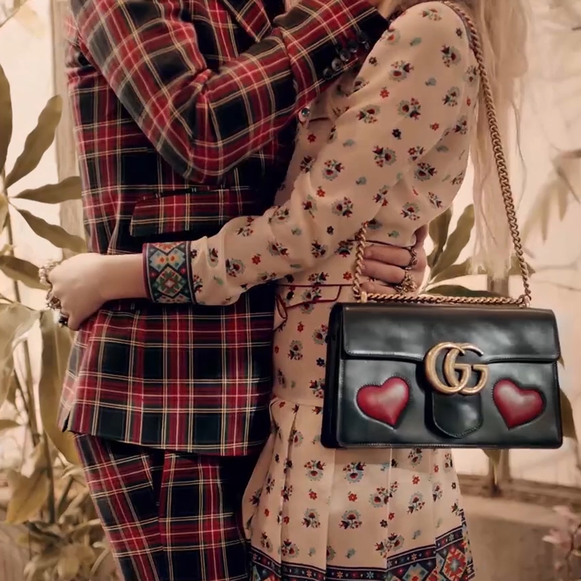 Photo of male and female in Gucci
